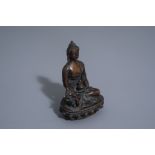 A Sino-Tibetan bronze figure of a seated Buddha, 19th C.