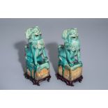 A pair of Chinese turquoise glazed models of Buddhist lions, 17th/18th C.