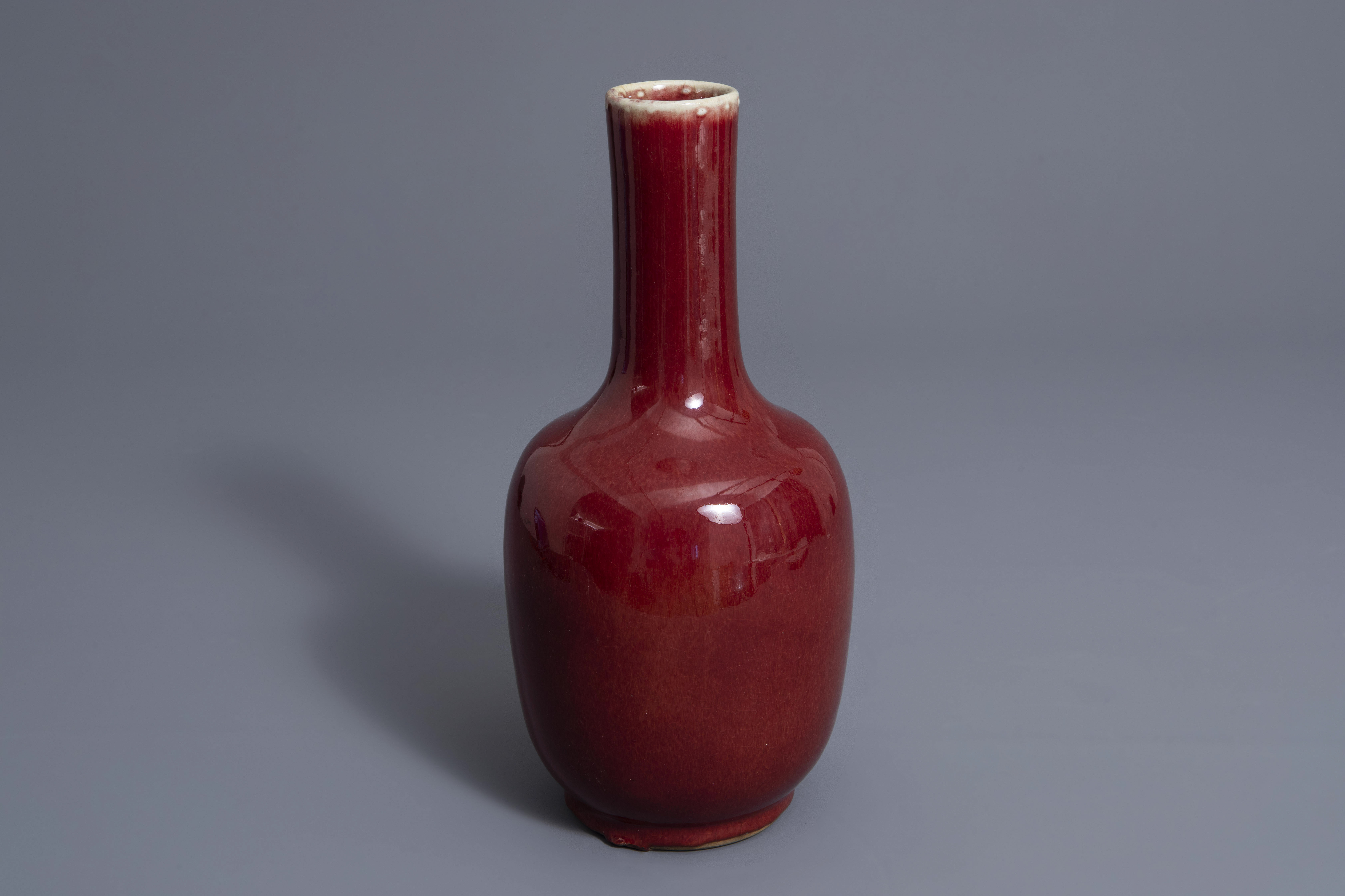 A Chinese sang de boeuf glazed bottle vase, Kangxi mark, 19th C.