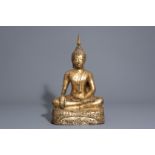 A gilt bronze figure of a seated Buddha, Thailand or Cambodia, 19th/20th C.