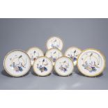 Eight Dutch Delft polychrome chargers and plates with a parrot, 18th C.