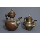 Two Tibetan copper jugs with silver finish, 19th C.