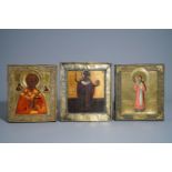 Three Russian icons, 'Saint Nicholas', with copper oklad or riza, 19th C.