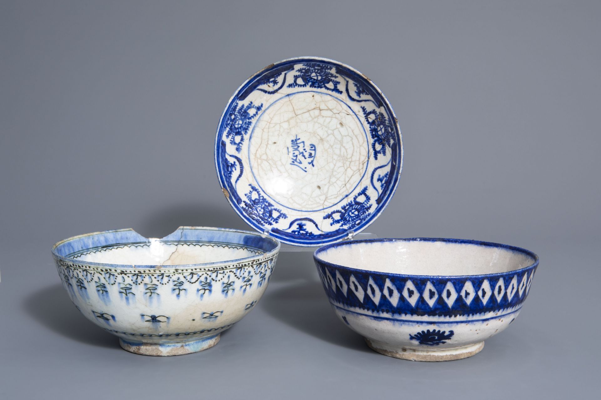 Two blue and white Islamic bowls and a plate, Syria or Iran, 19th C.