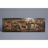 A large Chinese partly gilt carved wooden panel with a water buffalo, 19th C.