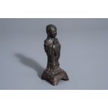 A Chinese bronze figure of a standing lady, Ming