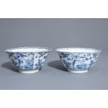 A pair of Chinese blue and white bowls with landscapes and floral design, Kangxi