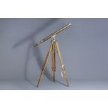 A Stanley London brass Harbor Master telescope on a wooden tripod stand, 20th C.