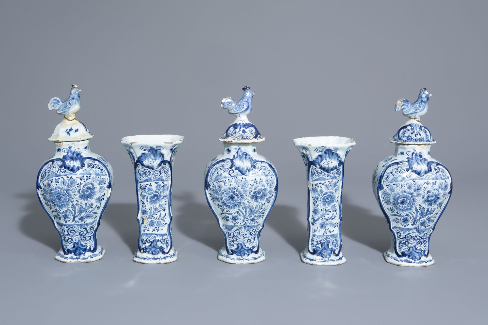 A Dutch Delft blue and white five-piece garniture with floral design, 18th C.