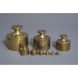 A French nine-piece set of copper bank weights for gold coins, 19th C.