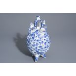 A Spanish blue and white pine cone shaped pottery jug, Talavera, 19th C.