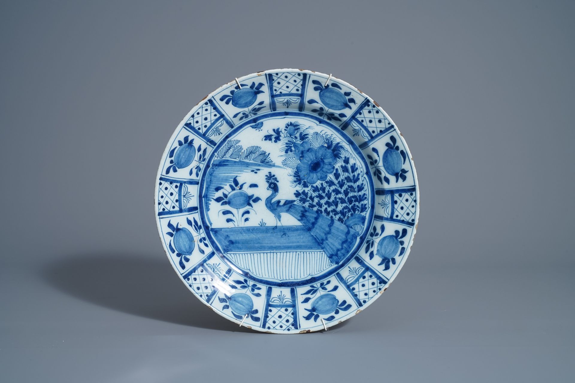 Twelve polychrome and blue and white Dutch Delft plates and an oval tray, 18th C. - Image 6 of 13
