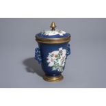 A Chinese famille verte powder blue ground cup and cover with floral design, Kangxi