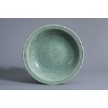 A Chinese Longquan celadon dish with underglaze design, Ming