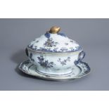 A Chinese blue, white and gilt tureen and cover on stand with floral design, Qianlong