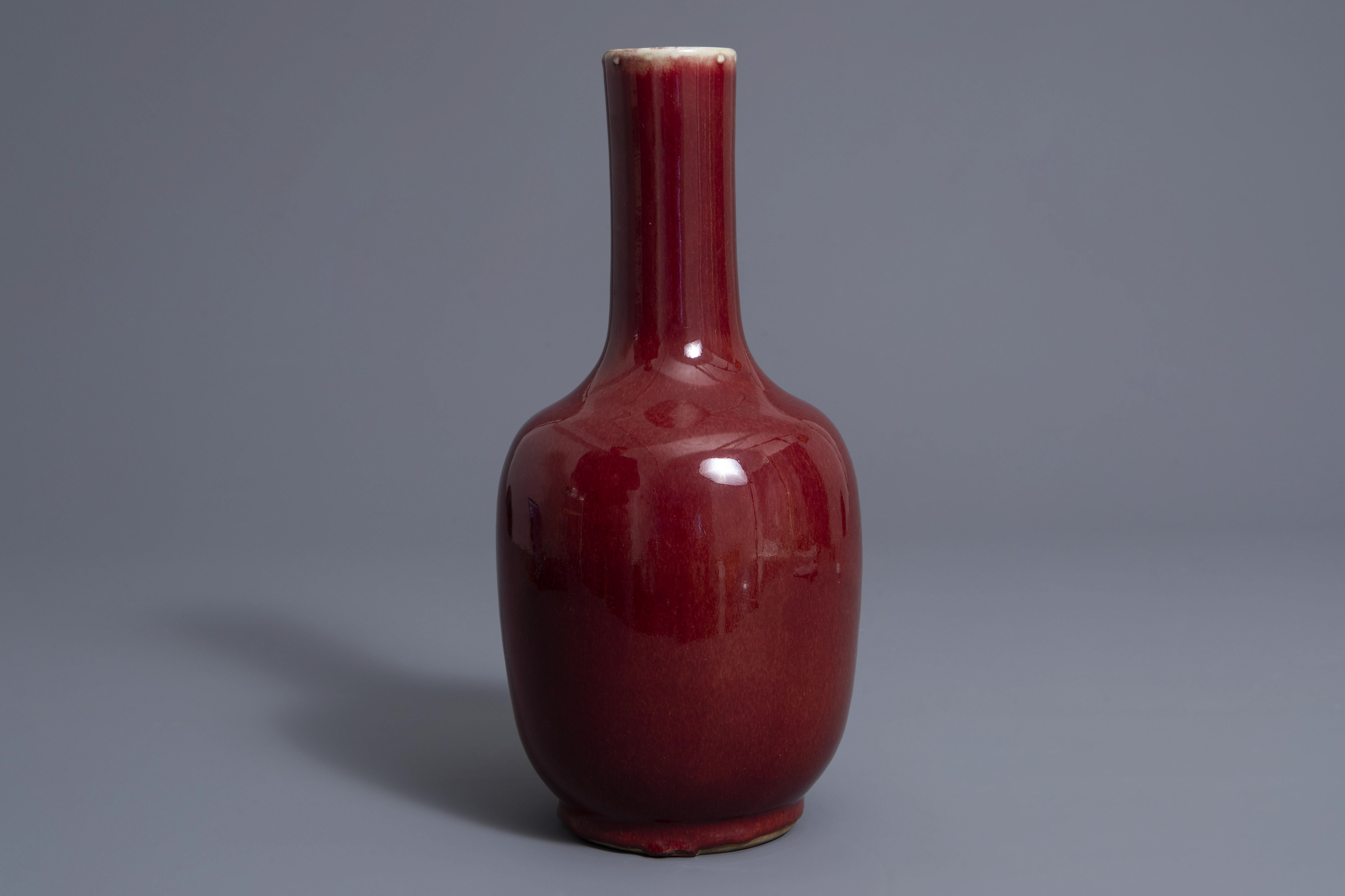 A Chinese sang de boeuf glazed bottle vase, Kangxi mark, 19th C. - Image 3 of 7