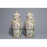 A pair of Chinese Canton famille rose vases and covers, 19th C.