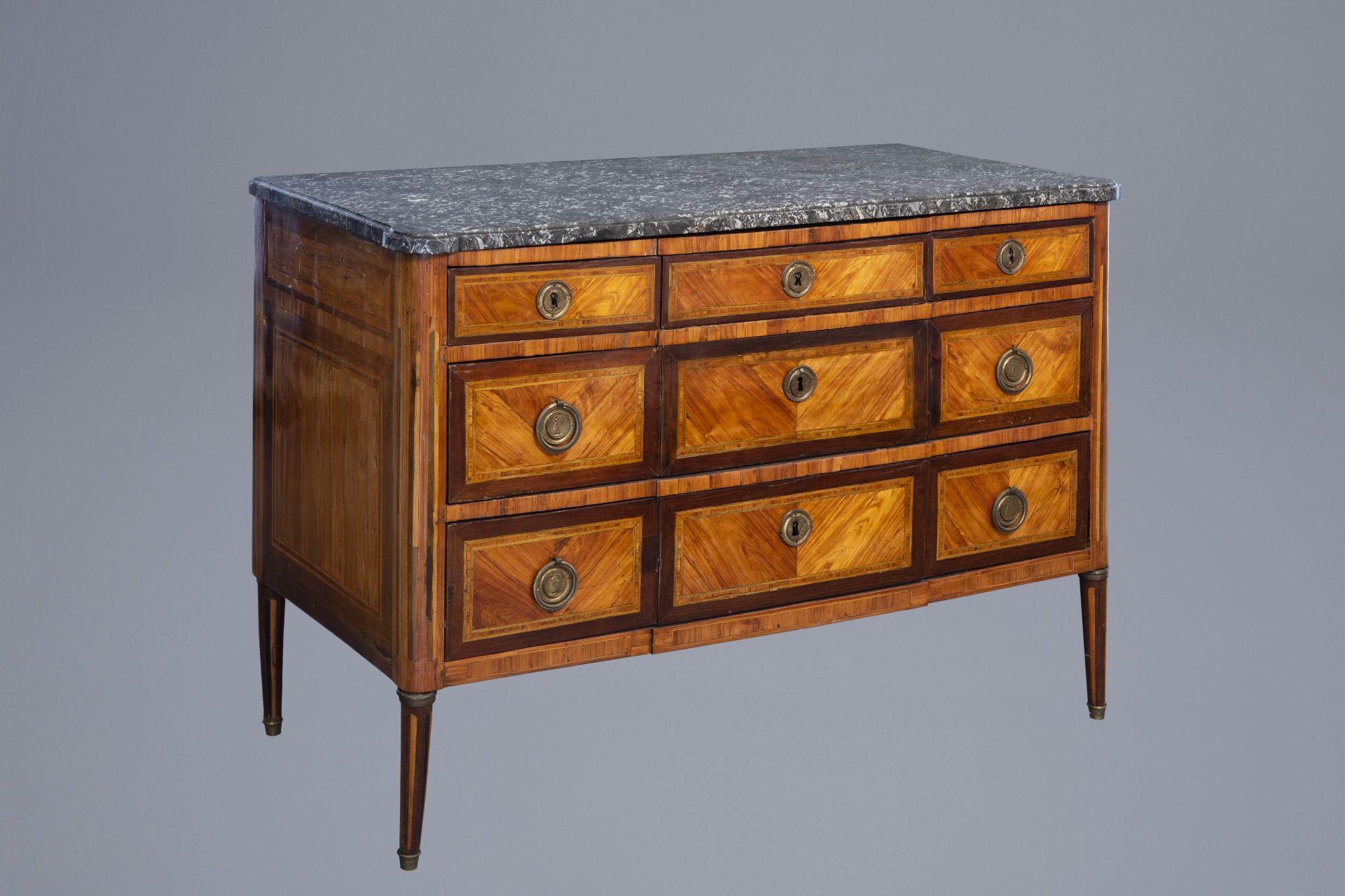 A French mahogany veneered Louis XVI chest of drawers with marble top, late 18th C.
