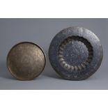 Two large hammered and silver inlaid brass dishes, Middle-East and India, 19th/20th C.