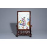 A Chinese wooden table screen with a famille rose plaque with the three star gods, 19th C.