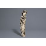 A Chinese ivory figure of a lady with flowers, seal mark, early 20th C.