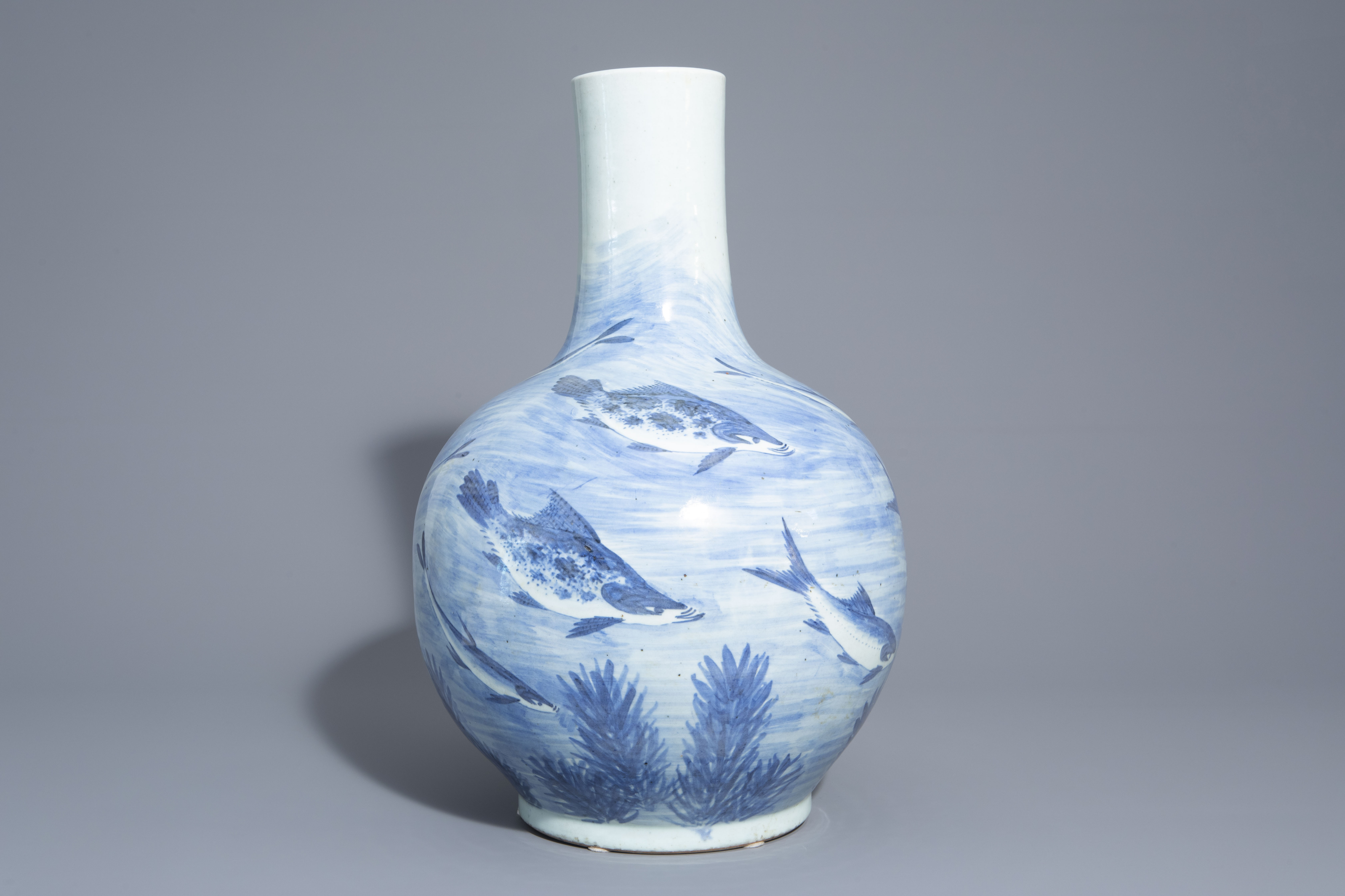 A large Chinese blue, white and copper red bottle shaped 'carps' vase, 20th C. - Image 3 of 6