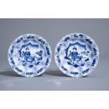 A pair of Chinese blue and white horserider saucers with scalloped rim, Kangxi