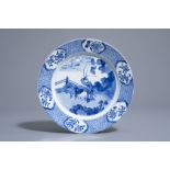 A Chinese blue and white dish with a shepherd, Kangxi