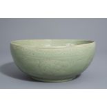 A Chinese Longquan celadon bowl with incised floral design, Ming or later