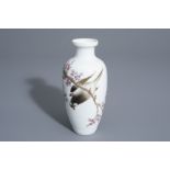 A Chinese famille rose vase with a bird among a flowering branch, 20th C.