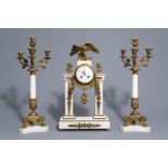 A three-piece gilt mounted and white marble garniture with an eagle, France, 19th/20th C.