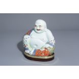 A Chinese famille rose figure of Buddha, 19th/20th C.