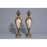 A pair of French gold layered blue ground Svres style vase: love scenes by Rochette, 19th/20th C.