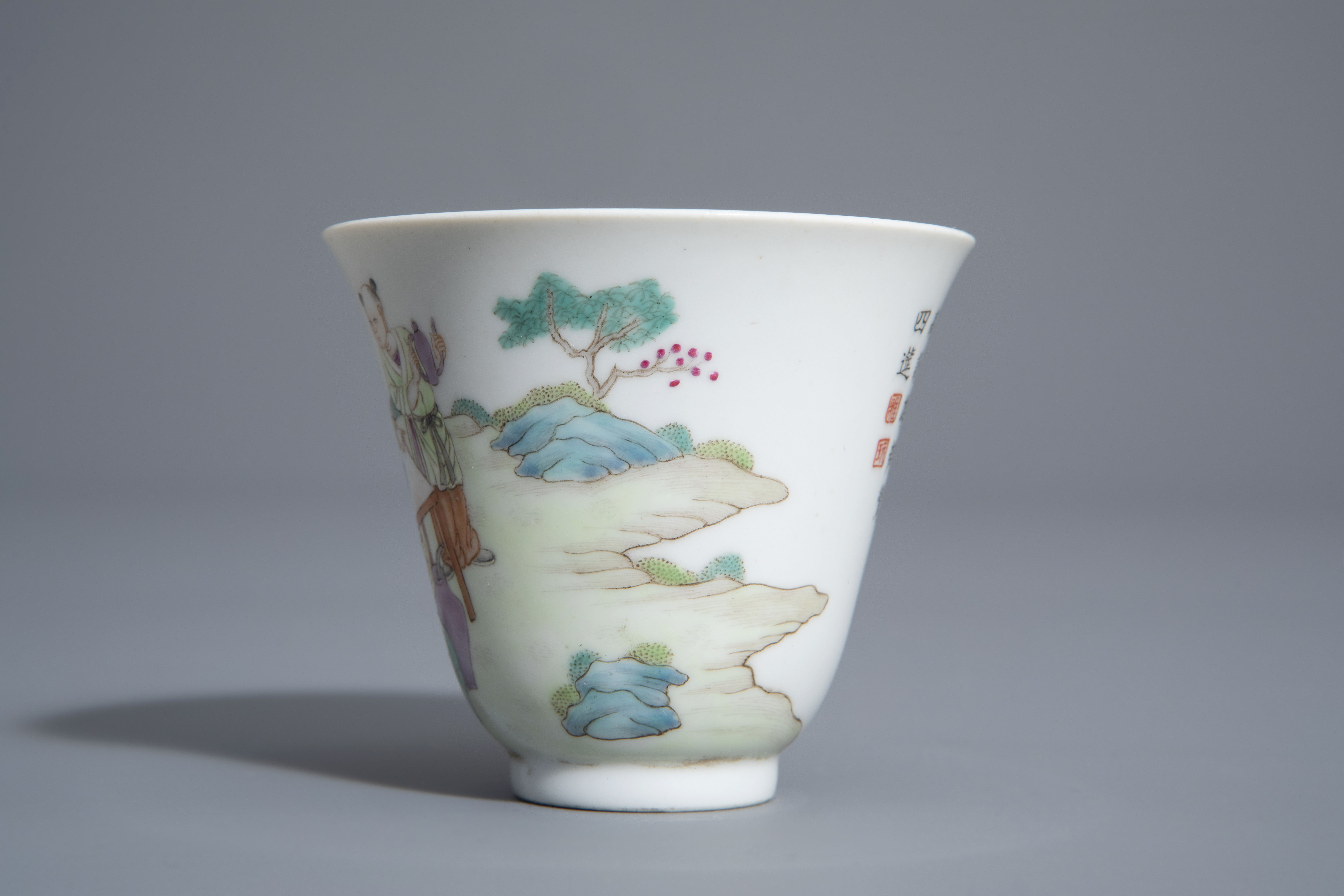 A Chinese famille rose cup and a saucer with different designs, 19th/20th C. - Image 8 of 11