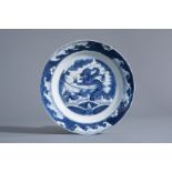 A Chinese blue and white 'dragon and carp' plate, Kangxi