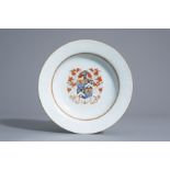 A Chinese export porcelain armorial plate with bianco sopra bianco design, Qianlong