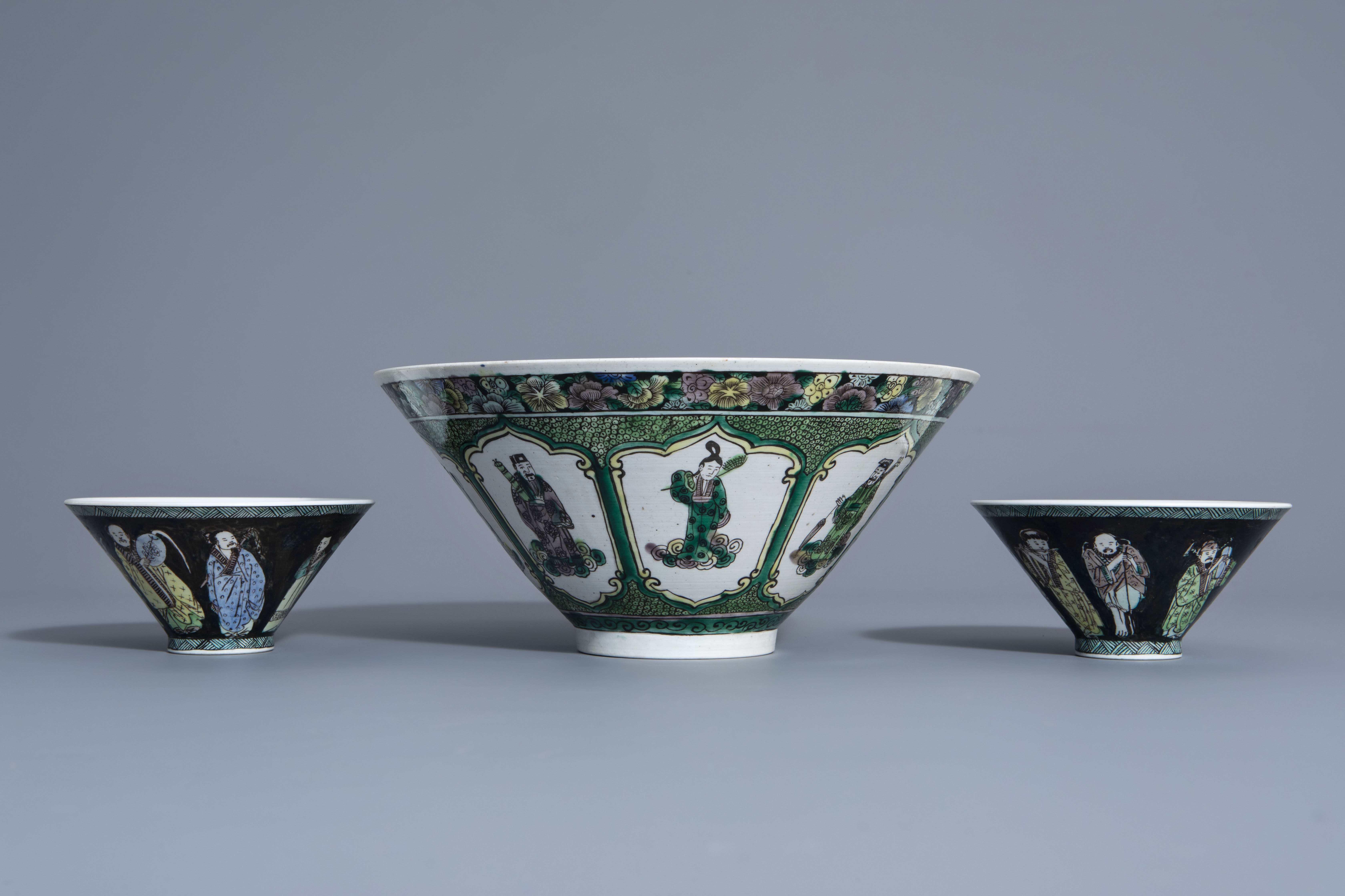 Three Chinese verte biscuit bowls with figurative design, Republic, 20th C.