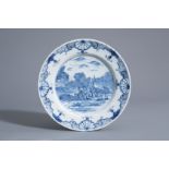 A Dutch Delft blue and white dish with hunters and their dogs, 18th C.