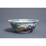 A Chinese famille rose 'ducks in a lotus pond' bowl, Kangxi mark, 19th/20th C.