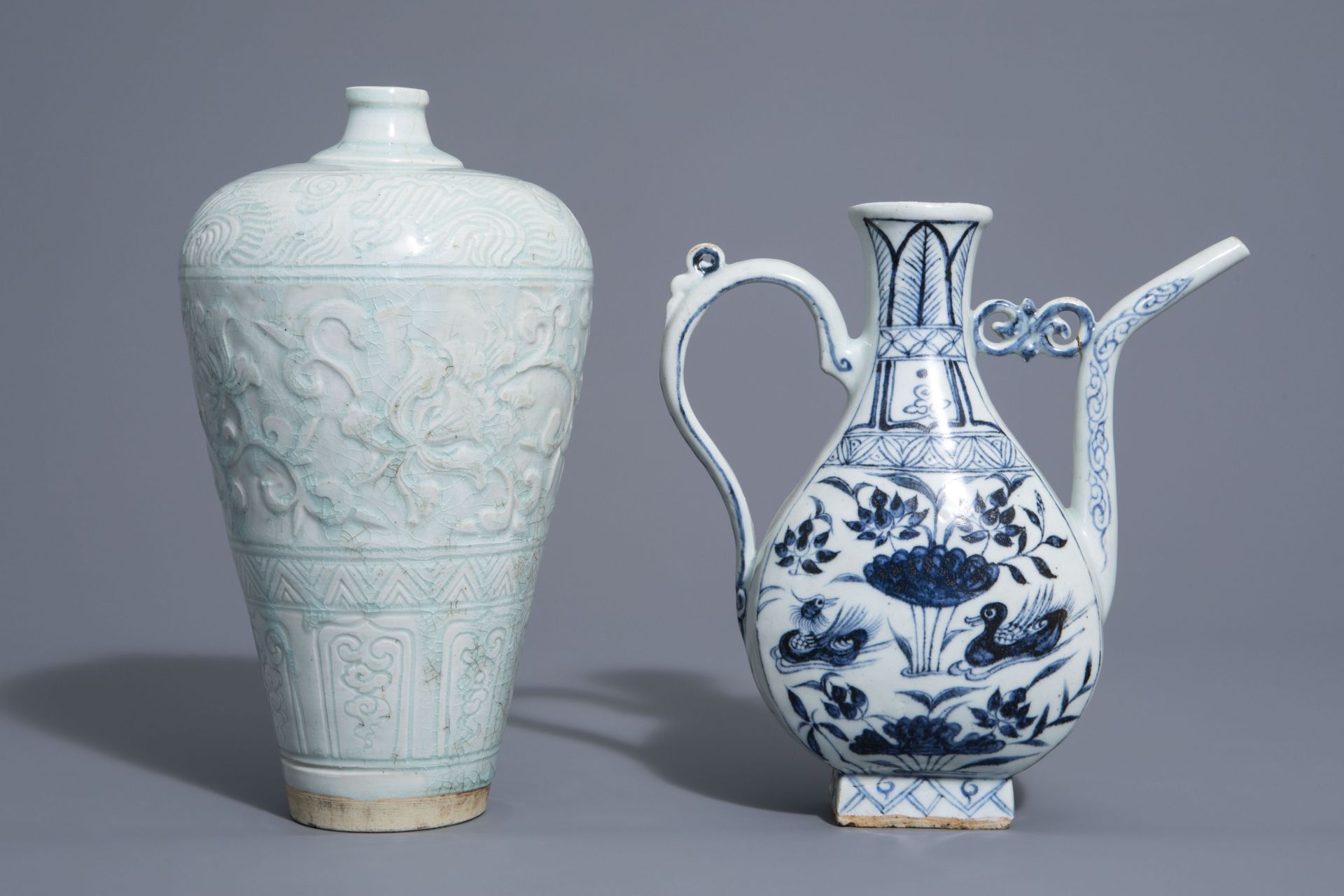 A Chinese blue and white jug and a qingbai vase in Yuan style, 19th/20th C.