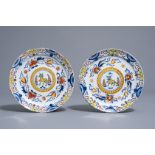 A pair of polychrome Dutch Delft Kakiemon style plates with a tiger, 18th C.