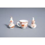 Two Chinese gilt and iron red doll's house miniature vases and a miniature cup, Kangxi/Qianlong