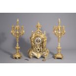 A French three-piece gilt bronze Renaissance and Baroque revival clock garniture, 19th/20th C.