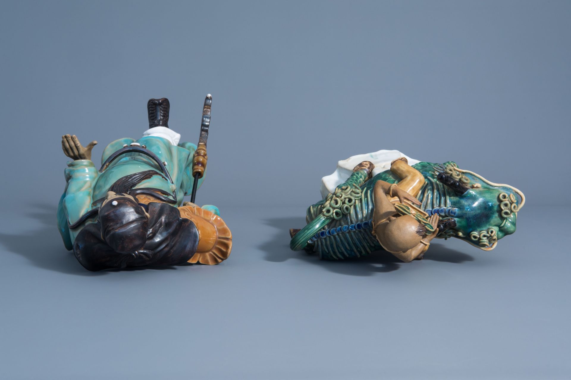 Two Chinese Shiwan pottery models of a warrior and a boy riding a Buddhist lion, 20th C. - Image 8 of 8