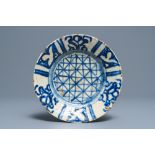 An Islamic blue and white fritware pottery plate, probably Syria, 18th/19th C.