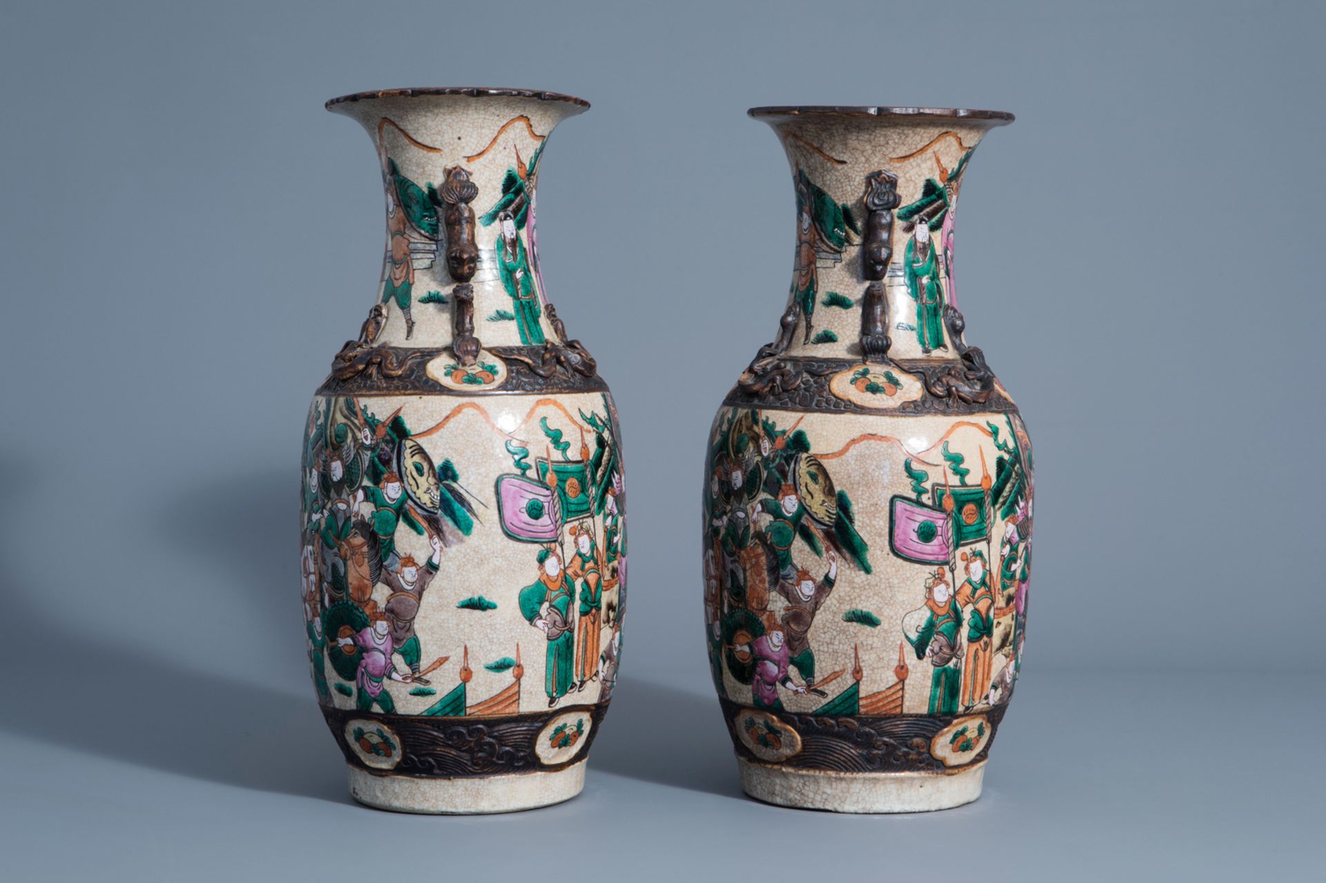 A pair of Chinese Nanking crackle glazed famille rose vases with warrior scenes, 19th C. - Image 2 of 6