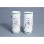 A pair of cylindrical Chinese famille rose vases with floral design, Qianlong