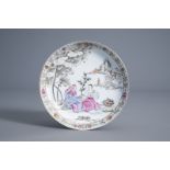 A Chinese famille rose plate with two figures and a cupid, Qianlong