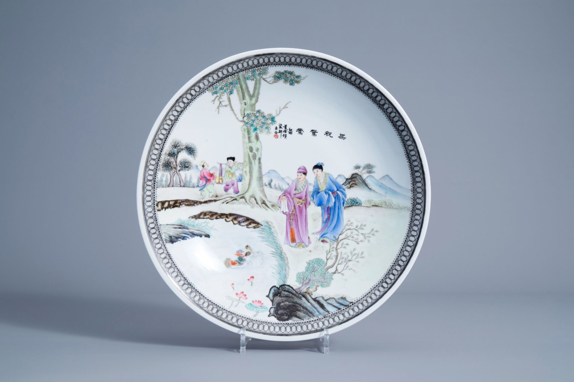 A Chinese famille rose charger with figures in a landscape, Qianlong mark, 20th C.