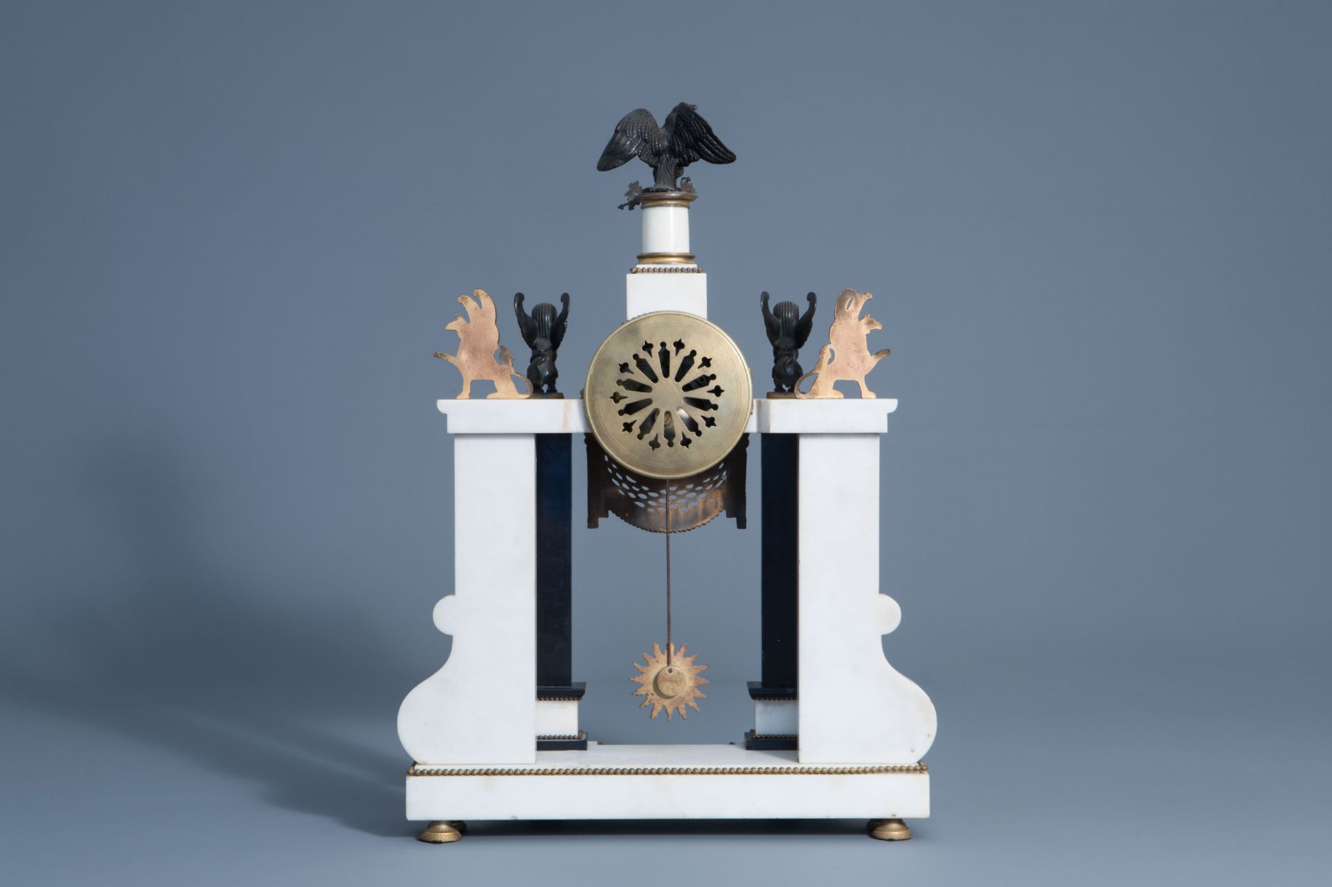 A French white and black marble gilt bronze mounted 'Return of Egypt' style portico clock, 19th C. - Image 4 of 14